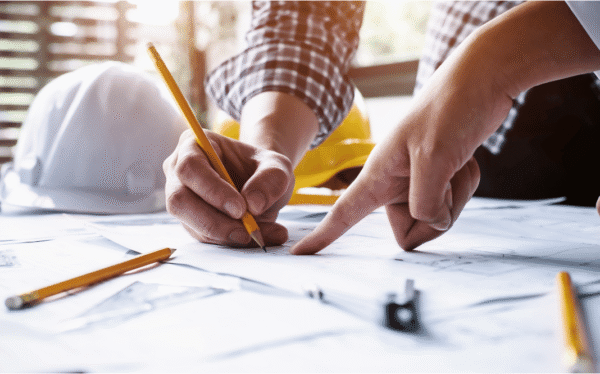 Contractor reviewing excavation plans with homeowner before starting work