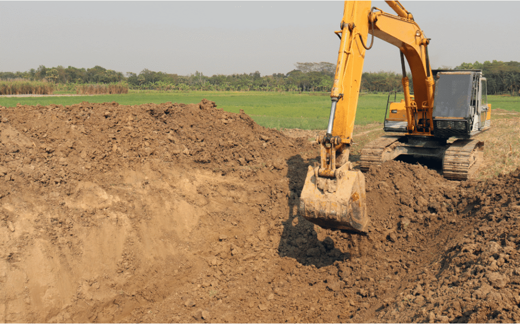 Excavation contractor clearing and grading land for a construction project